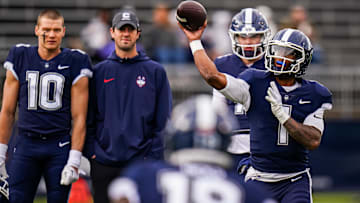 Nov 18, 2023; East Hartford, Connecticut, USA; UConn Huskies quarterback Ta'Quan Roberson (1) warms up before the start of the game against the Sacred Heart Pioneers at Rentschler Field at Pratt & Whitney Stadium. Mandatory Credit: David Butler II-Imagn Images