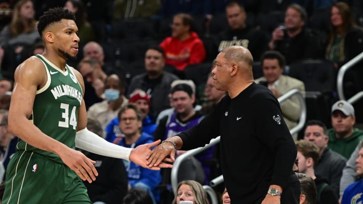 Milwaukee Bucks head coach Doc Rivers greets forward Giannis Antetokounmpo (34) in the fourth quarter against the Memphis Grizzlies at Fiserv Forum. 