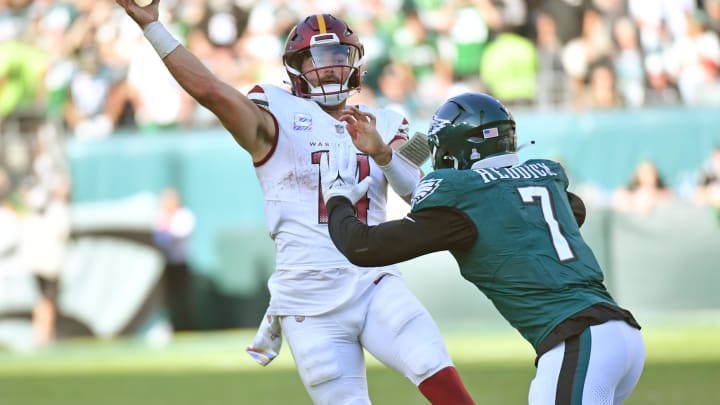 Oct 1, 2023; Philadelphia, PA; Washington Commanders quarterback Sam Howell (14) throws pass under pressure from Philadelphia Eagles linebacker Haason Reddick (7) during the fourth quarter at Lincoln Financial Field 