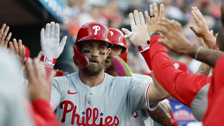 Jun 24, 2024; Detroit, Michigan, USA;  Philadelphia Phillies first baseman Bryce Harper (3) receives congratulations from teammates after he hits a three-run home run in the sixth inning against the Detroit Tigers at Comerica Park. 