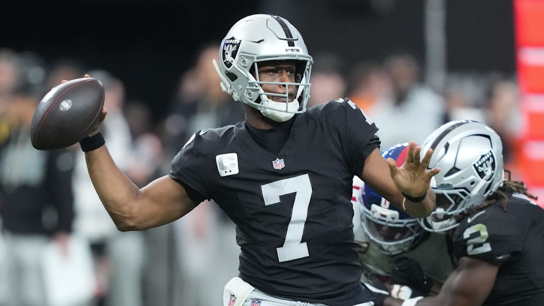 Dec 28, 2025; Paradise, Nevada, USA; Las Vegas Raiders quarterback Geno Smith (7) throws in the third quarter against the New York Giants at Allegiant Stadium. Mandatory Credit: Kirby Lee-Imagn Images