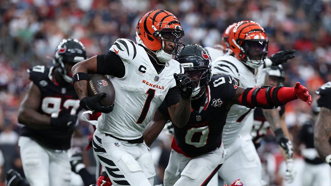 Sep 20, 2026; Houston, Texas, USA;  Cincinnati Bengals wide receiver Ja'Marr Chase (1) runs after a catch against Houston Texans linebacker Azeez Al-Shaair (0) during the third quarter at Reliant Stadium.  Mandatory Credit: Troy Taormina-Imagn Images