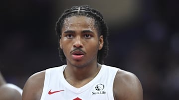 Oct 31, 2025; Cleveland, Ohio, USA; Toronto Raptors forward Collin Murray-Boyles (12) walks on the court in the third quarter against the Cleveland Cavaliers at Rocket Arena. Mandatory Credit: David Richard-Imagn Images