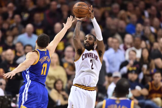 Kyrie Irving shoots over Klay Thompson