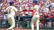 Apr 20, 2025; Philadelphia, Pennsylvania, USA; Philadelphia Phillies shortstop Trea Turner (7) and second base Bryson Stott (5) celebrate after scoring during the first inning against the Miami Marlins at Citizens Bank Park.