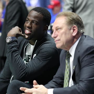 Mar 19, 2017; Tulsa, OK, USA; Golden State Warriors power forward Draymond Green speaks to Michigan State Spartans head coach Tom Izzo before the game between the Kansas Jayhawks and the Michigan State Spartans in the second round of the 2017 NCAA Tournament at BOK Center. Mandatory Credit: Brett Rojo-Imagn Images