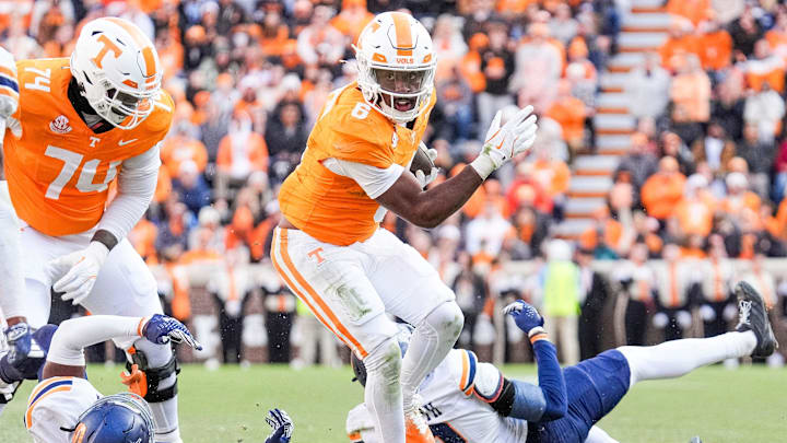 Tennessee running back Dylan Sampson (6) escapes tackles during a college football game between Tennessee and UTEP at Neyland Stadium in Knoxville, Tenn., Saturday, Nov. 23, 2024.