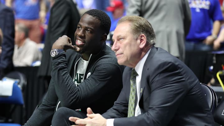 Mar 19, 2017; Tulsa, OK, USA; Golden State Warriors power forward Draymond Green speaks to Michigan State Spartans head coach Tom Izzo before the game between the Kansas Jayhawks and the Michigan State Spartans in the second round of the 2017 NCAA Tournament at BOK Center. Mandatory Credit: Brett Rojo-Imagn Images