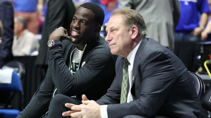 Mar 19, 2017; Tulsa, OK, USA; Golden State Warriors power forward Draymond Green speaks to Michigan State Spartans head coach Tom Izzo before the game between the Kansas Jayhawks and the Michigan State Spartans in the second round of the 2017 NCAA Tournament at BOK Center. Mandatory Credit: Brett Rojo-Imagn Images