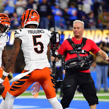 Nov 17, 2024; Inglewood, California, USA; Cincinnati Bengals wide receiver Tee Higgins (5) celebrates his touchdown scored against the Los Angeles Chargers with wide receiver Ja'Marr Chase (1) and running back Chase Brown (30) during the second half at SoFi Stadium. Mandatory Credit: Gary A. Vasquez-Imagn Images