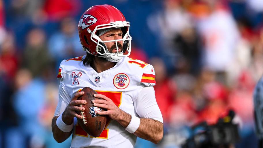 Gardner Mindshew II holds a ball to his chest in a Chiefs jersey.