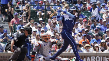 Jun 21, 2024; Chicago, Illinois, USA; Chicago Cubs outfielder Cody Bellinger (24) hits a single against the New York Mets during the first inning at Wrigley Field. 