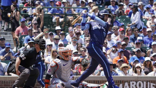 Jun 21, 2024; Chicago, Illinois, USA; Chicago Cubs outfielder Cody Bellinger (24) hits a single against the New York Mets during the first inning at Wrigley Field. 