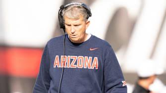 Arizona Wildcats head coach Brent Brennan walks the sideline in the fourth quarter of the NCAA football game between the Cincinnati Bearcats and Arizona Wildcats at Nippert Stadium in Cincinnati on Nov. 15, 2025.