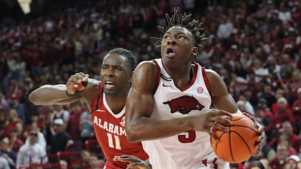 Arkansas Razorbacks forward Adou Thiero (3) drives past Alabama Crimson Tide center Clifford Omoruyi (11)