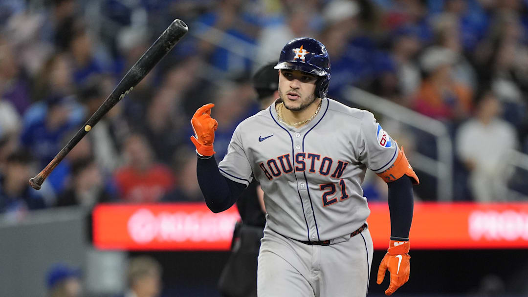 Sep 10, 2025; Toronto, Ontario, CAN; Houston Astros catcher Yainer Diaz (21) flips his bat after hitting a solo home run against the Toronto Blue Jays during the ninth inning to win the game  at Rogers Centre. 