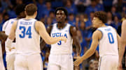Nov 7, 2025; Los Angeles, California, USA;  UCLA Bruins forward Eric Dailey Jr. (3) is greeted by forward Tyler Bilodeau (34) and guard Trent Perry (0) during the first half against the Pepperdine Waves at Pauley Pavilion presented by Wescom Financial. Mandatory Credit: Kiyoshi Mio-Imagn Images