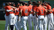 Jun 16, 2024; Omaha, NE, USA;  The Virginia Cavaliers meet on the field after the loss against the Florida State Seminoles at Charles Schwab Field Omaha. Mandatory Credit: Steven Branscombe-Imagn Images
