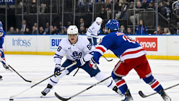 Mar 20, 2025; New York, New York, USA;  Toronto Maple Leafs right wing William Nylander (88) skates across the blue line defended by New York Rangers defenseman Zac Jones (6) during the third period at Madison Square Garden. Mandatory Credit: Dennis Schneidler-Imagn Images