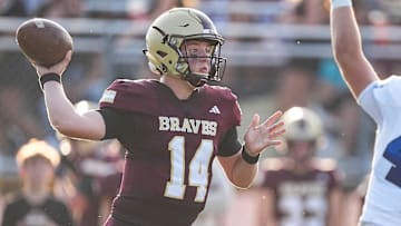 Brebeuf Jesuit Preparatory's quarterback Maverick Geske (14) throws the ball Friday, Aug. 23, 2024, during the game at Brebeuf Jesuit Preparatory School in Indianapolis.