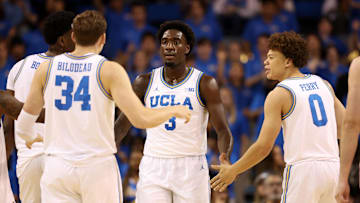 Nov 7, 2025; Los Angeles, California, USA;  UCLA Bruins forward Eric Dailey Jr. (3) is greeted by forward Tyler Bilodeau (34) and guard Trent Perry (0) during the first half against the Pepperdine Waves at Pauley Pavilion presented by Wescom Financial. Mandatory Credit: Kiyoshi Mio-Imagn Images
