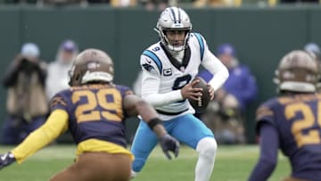 Nov 2, 2025; Green Bay, Wisconsin, USA; Carolina Panthers quarterback Bryce Young (9) runs for a first down during the third quarter of their game against the Green Bay Packers  at Lambeau Field. Mandatory Credit: Mark Hoffman-USA TODAY Network via Imagn Images