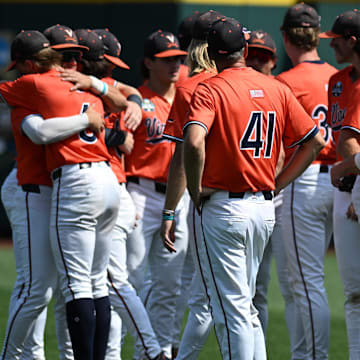 Jun 16, 2024; Omaha, NE, USA;  The Virginia Cavaliers meet on the field after the loss against the Florida State Seminoles at Charles Schwab Field Omaha. Mandatory Credit: Steven Branscombe-Imagn Images
