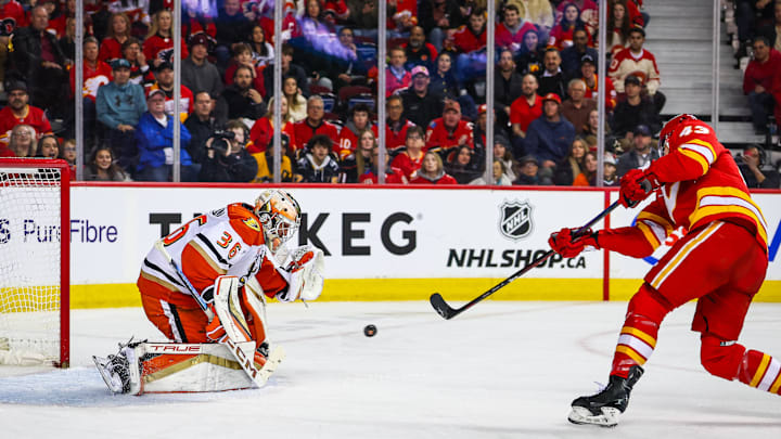 Apr 3, 2025; Calgary, Alberta, CAN; Anaheim Ducks goaltender John Gibson (36) makes a save against Calgary Flames right wing Adam Klapka (43) during the second period at Scotiabank Saddledome. Mandatory Credit: Sergei Belski-Imagn Images