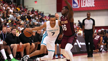 Jul 13, 2022; Las Vegas, NV, USA; Charlotte Hornets forward Bryce McGowens (7) dribbles against Cleveland Cavaliers guard Amauri Hardy (36) during an NBA Summer League game at Cox Pavilion. Mandatory Credit: Stephen R. Sylvanie-Imagn Images