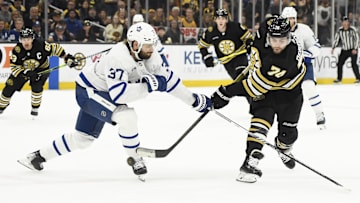 May 4, 2024; Boston, Massachusetts, USA; Boston Bruins left wing Jake DeBrusk (74) shoots the puck while Toronto Maple Leafs defenseman Timothy Liljegren (37) defends during the third period in game seven of the first round of the 2024 Stanley Cup Playoffs at TD Garden. Mandatory Credit: Bob DeChiara-Imagn Images