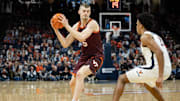 Feb 1, 2025; Charlottesville, Virginia, USA; Virginia Tech Hokies center Patrick Wessler (5) controls the ball as Virginia Cavaliers forward Anthony Robinson (21) defends in the second half at John Paul Jones Arena. Mandatory Credit: Emily Morgan-Imagn Images