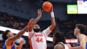 Jan 25, 2025; Syracuse, New York, USA; Syracuse Orange center Eddie Lampkin Jr. (44) shoots against Pittsburgh Panthers forward Cameron Corhen (left) during the second half at the JMA Wireless Dome. Mandatory Credit: Rich Barnes-Imagn Images
