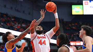 Jan 25, 2025; Syracuse, New York, USA; Syracuse Orange center Eddie Lampkin Jr. (44) shoots against Pittsburgh Panthers forward Cameron Corhen (left) during the second half at the JMA Wireless Dome. Mandatory Credit: Rich Barnes-Imagn Images