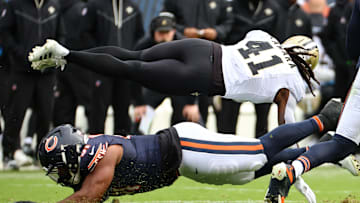 Oct 19, 2025; Chicago, Illinois, USA; New Orleans Saints running back Alvin Kamara (41) dives for a first down against the Chicago Bears during the second half at Soldier Field. Mandatory Credit: Mike Dinovo-Imagn Images
