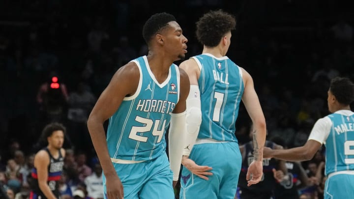 Oct 27, 2023; Charlotte, North Carolina, USA; Charlotte Hornets guard LaMelo Ball (1) gives forward Brandon Miller (24) a low high five after a play against the Detroit Pistons during the second quarter at Spectrum Center. Mandatory Credit: Jim Dedmon-USA TODAY Sports