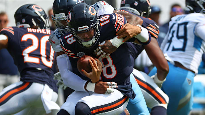 Sep 8, 2024; Chicago, Illinois, USA; Tennessee Titans linebacker Harold Landry III (58) sacks Chicago Bears quarterback Caleb Williams (18) during the second quarter at Soldier Field. Mandatory Credit: Mike Dinovo-Imagn Images