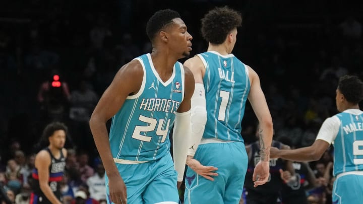 Oct 27, 2023; Charlotte, North Carolina, USA; Charlotte Hornets guard LaMelo Ball (1) gives forward Brandon Miller (24) a low high five after a play against the Detroit Pistons during the second quarter at Spectrum Center. 