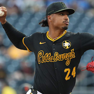 Aug 4, 2025; Pittsburgh, Pennsylvania, USA;  Pittsburgh Pirates starting pitcher Johan Oviedo (24) delivers a pitch against the San Francisco Giants during the first inning at PNC Park. Mandatory Credit: Charles LeClaire-Imagn Images