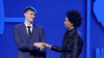 Jun 25, 2025; Brooklyn, NY, USA; Cooper Flagg and Dylan Harper shake hands on stage before the 2025 NBA Draft at Barclays Center. Mandatory Credit: Brad Penner-Imagn Images