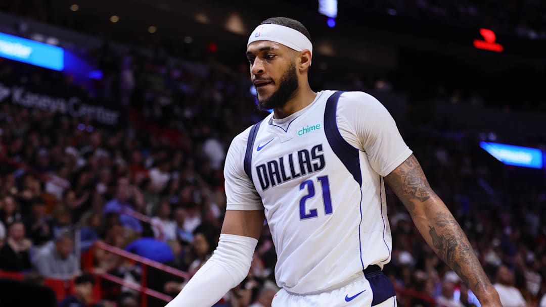 Apr 10, 2024; Miami, Florida, USA; Dallas Mavericks center Daniel Gafford (21) returns to the bench against the Miami Heat during the third quarter at Kaseya Center. Mandatory Credit: Sam Navarro-Imagn Images