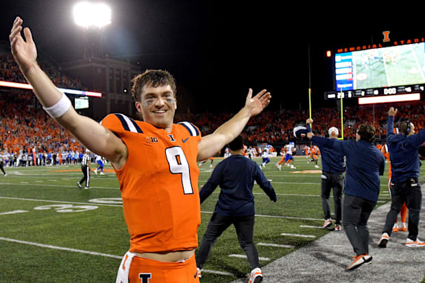  Illinois Fighting Illini quarterback Luke Altmyer (9) celebrates a win over the Kansas Jayhawks at Memorial Stadium.