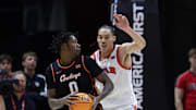 Jan 11, 2025; Salt Lake City, Utah, USA; Oklahoma State Cowboys forward Marchelus Avery (0) moves the ball against Utah Utes forward Keanu Dawes (8) during the second half at Jon M. Huntsman Center. Mandatory Credit: Rob Gray-Imagn Images