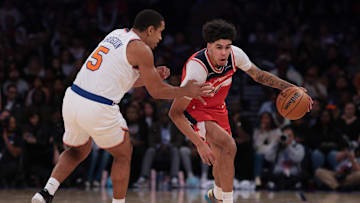 Oct 13, 2025; New York, New York, USA; Washington Wizards forward Will Riley (27) dribbles against New York Knicks guard Malcolm Brogdon (5) during the second half at Madison Square Garden. Mandatory Credit: Vincent Carchietta-Imagn Images