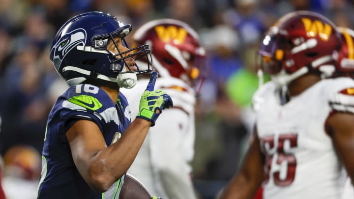 Nov 12, 2023; Seattle, Washington, USA; Seattle Seahawks wide receiver Tyler Lockett (16) reacts after catching a touchdown pass against the Washington Commanders during the fourth quarter at Lumen Field.