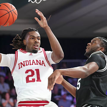Indiana Hoosiers forward Mackenzie Mgbako (21) looks to shoot as Providence Friars forward Oswin Erhunmwunse (55) defends during the first half at Imperial Arena at the Atlantis resort.