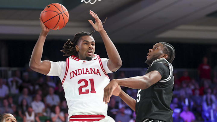 Indiana Hoosiers forward Mackenzie Mgbako (21) looks to shoot as Providence Friars forward Oswin Erhunmwunse (55) defends during the first half at Imperial Arena at the Atlantis resort. Indiana Hoosiers forward Mackenzie Mgbako (21) looks to shoot as Providence Friars forward Oswin Erhunmwunse (55) defends during the first half at Imperial Arena at the Atlantis resort.