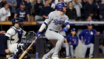 Oct 30, 2024; New York, New York, USA; Los Angeles Dodgers second baseman Gavin Lux (9) hits a RBI sacrifice fly during the eighth inning against the New York Yankees in game five of the 2024 MLB World Series at Yankee Stadium. Mandatory Credit: Vincent Carchietta-Imagn Images
