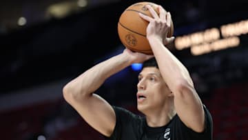 Mar 9, 2025; Portland, Oregon, USA;  Detroit Pistons forward Simone Fontecchio (19) shoots the ball before playing in a game against the Portland Trail Blazers at Moda Center. Mandatory Credit: Jaime Valdez-Imagn Images