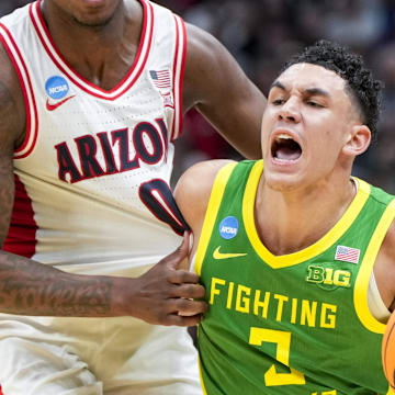 Mar 23, 2025; Seattle, WA, USA;  Oregon Ducks guard Jackson Shelstad (3) dribbles the ball against Arizona Wildcats guard Jaden Bradley (0) in the second half at Climate Pledge Arena. Mandatory Credit: Stephen Brashear-Imagn Images