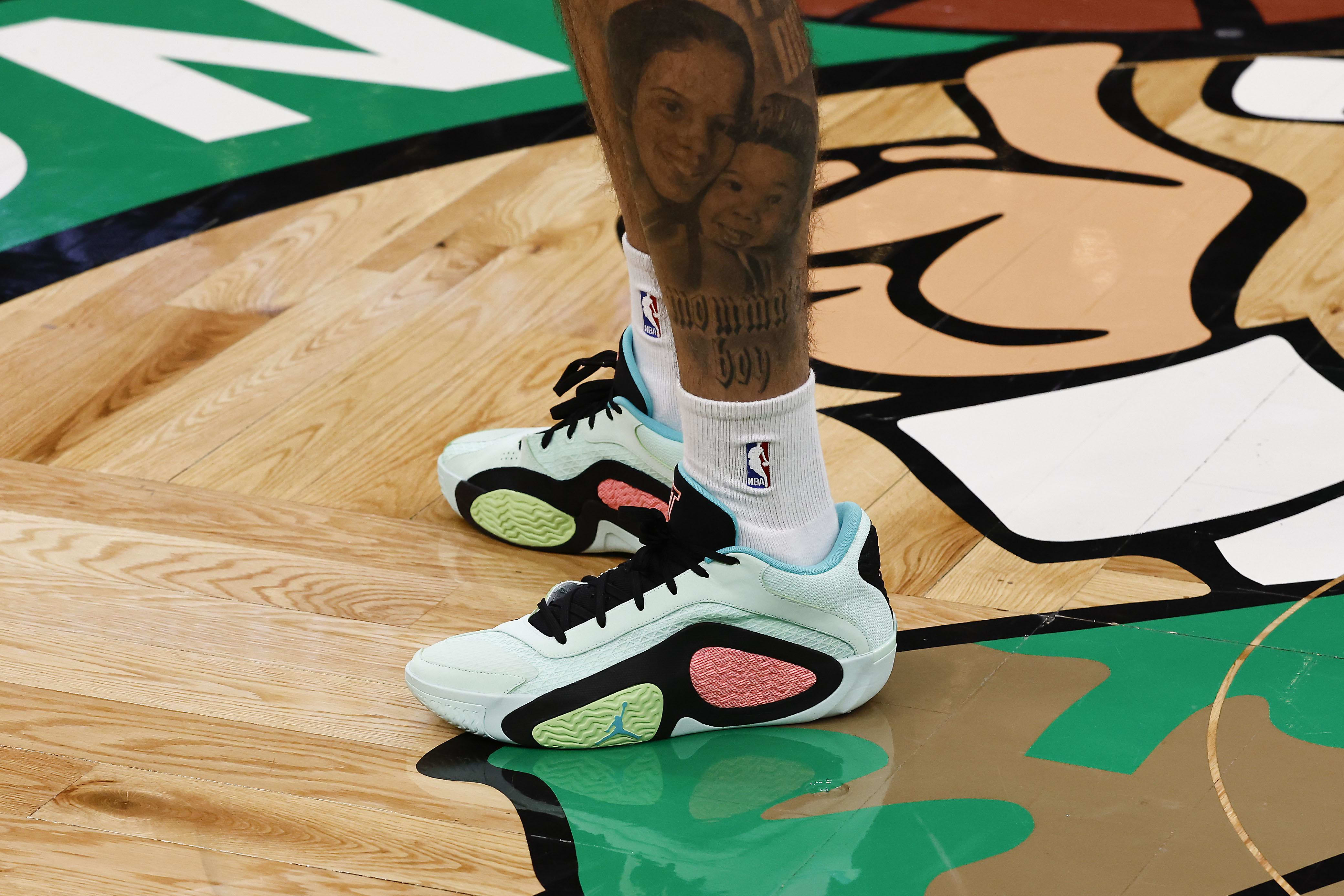 Boston Celtics forward Jayson Tatum's green Jordan Brand sneakers.